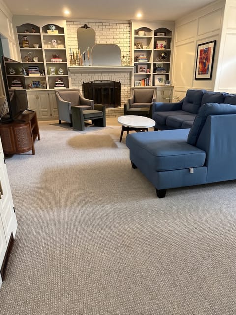 Living room with wall-to-wall carpet flooring