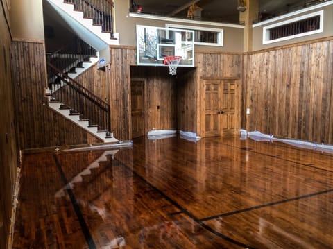Home basketball court with refinished red oak flooring